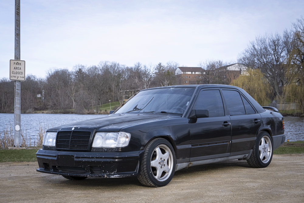 Mercedes-Benz 300E in front of Comus Lake in Delevan.