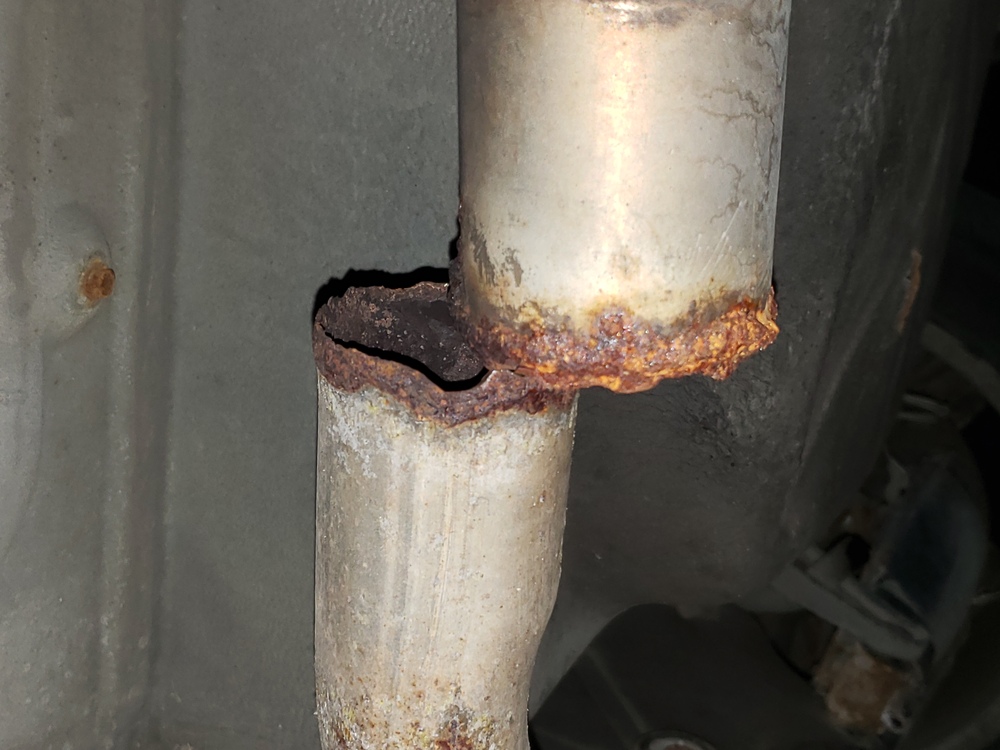 Exhaust pipe rusted and separated.