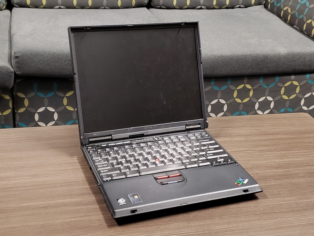 ThinkPad T22 open on table.