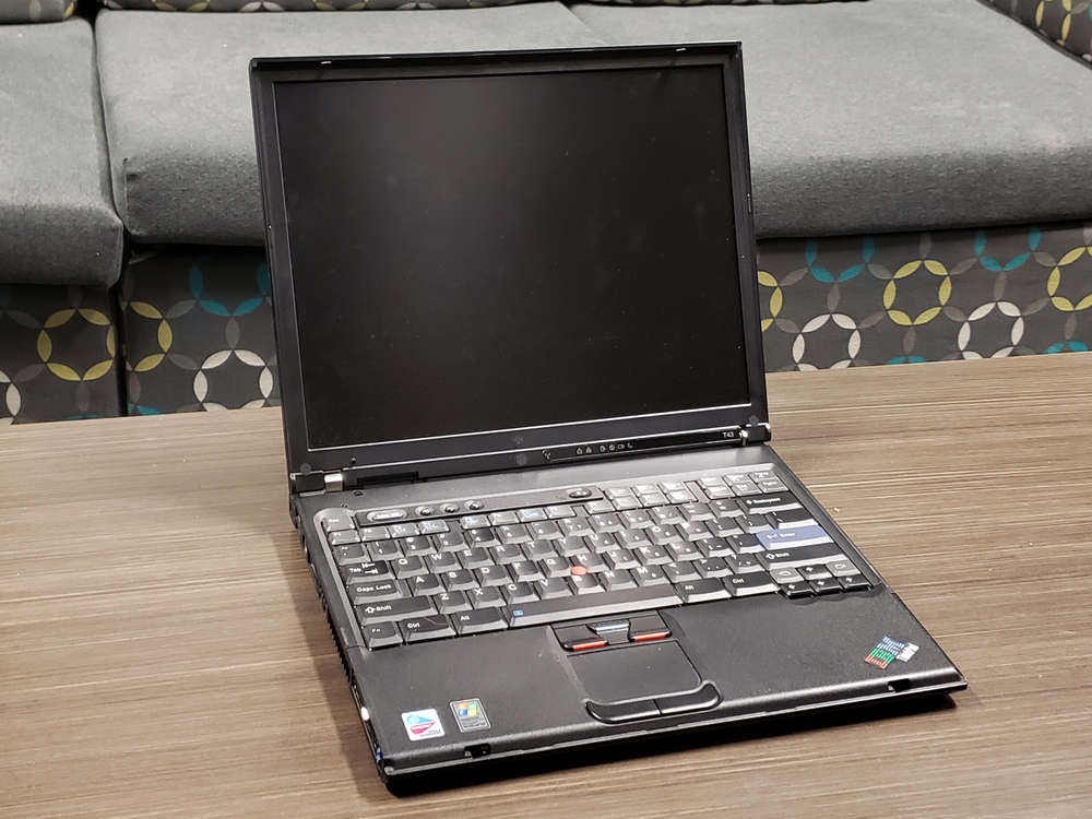 ThinkPad T43 open on table.